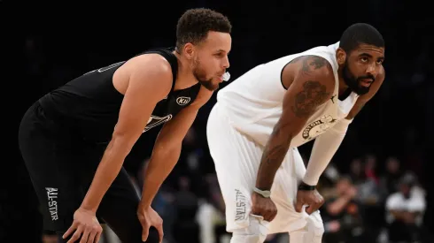 Stephen Curry #30 of Team Stephen and Kyrie Irving #11 of Team LeBron take a breath during the NBA All-Star Game 2018.