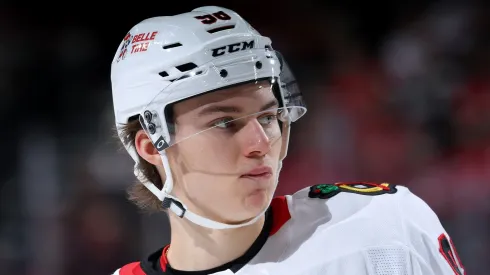 Connor Bedard #98 of the Chicago Blackhawks looks on before a faceoff against the New Jersey Devils during the third period at Prudential Center on December 14, 2024 in Newark, New Jersey. The New Jersey Devils defeated the Chicago Blackhawks 4-1.