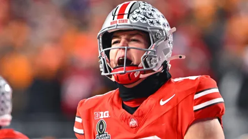 Will Howard #18 of the Ohio State Buckeyes celebrates after a touchdown against the Tennessee Volunteers during the third quarter in the Playoff First Round Game at Ohio Stadium on December 21, 2024 in Columbus, Ohio.
