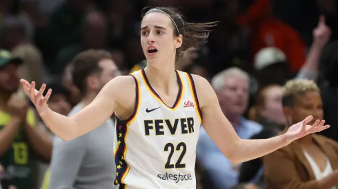 Indiana Fever star Caitlin Clark reacts during a WNBA match 
