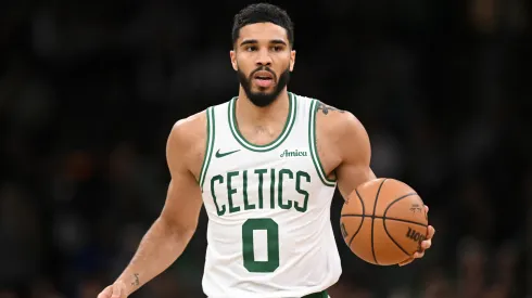 Jayson Tatum #0 of the Boston Celtics dribbles the ball up the court during the second half of a game against the Milwaukee Bucks
