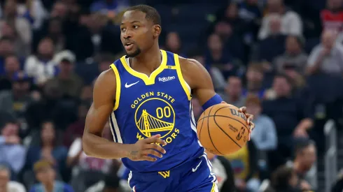 Jonathan Kuminga #00 of the Golden State Warriors drives against the Houston Rockets during the second half of a quarterfinal game in the NBA Emirates Cup.
