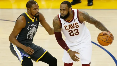 Kevin Durant #35 of the Golden State Warriors defends against LeBron James #23 of the Cleveland Cavaliers in Game 2 of the 2018 NBA Finals.  
