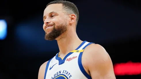 Stephen Curry #30 of the Golden State Warriors grimaces on the court between plays in the fourth quarter against the Los Angeles Clippers at Chase Center on October 27, 2024 in San Francisco, California. 
