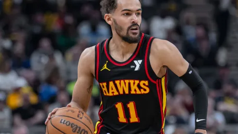 Trae Young #11 of the Atlanta Hawks brings the ball up court during the game against the Indiana Pacers at Gainbridge Fieldhouse on April 14, 2024 in Indianapolis, Indiana.
