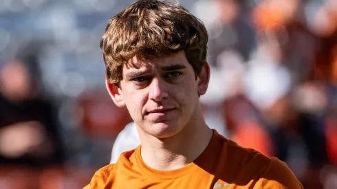 Arch Manning 16 of the Texas Longhorns during warmups before the game vs the Clemson Tigers in the first round of the playoffs at DKR-Memorial Stadium.
