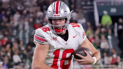 Ohio State Buckeyes quarterback Will Howard (18) carries the ball during the game between the Ohio State Buckeyes and Michigan State Spartans at Spartan Stadium, East Lansing, Michigan.
