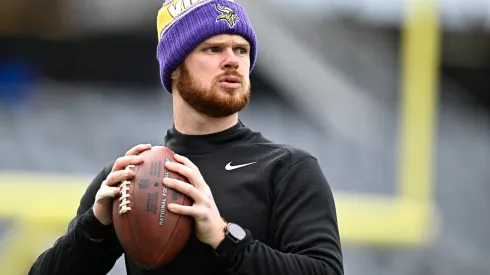 Sam Darnold #14 warms up before playing the Chicago Bears at Soldier Field on November 24, 2024.