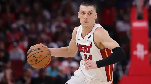 Tyler Herro #14 of the Miami Heat drives against the Houston Rockets during the first half at Toyota Center.
