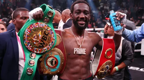  Terence Crawford celebrates with the championship belt after defeating Errol Spence Jr. in the World Welterweight Championship bout at T-Mobile Arena on July 29, 2023 in Las Vegas, Nevada.
