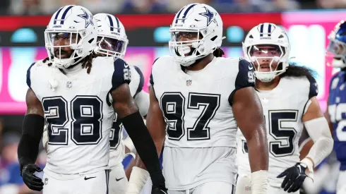 Malik Hooker #28 and Osa Odighizuwa #97 of the Dallas Cowboys look on during the game against the New York Giants at MetLife Stadium on September 26, 2024.
