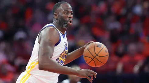 Draymond Green #23 of the Golden State Warriors drives against the Houston Rockets during the second half of a quarterfinal game in the NBA Emirates Cup.
