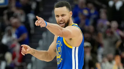 Stephen Curry #30 of the Golden State Warriors reacts after scoring against the Los Angeles Lakers during the second half at Chase Center.
