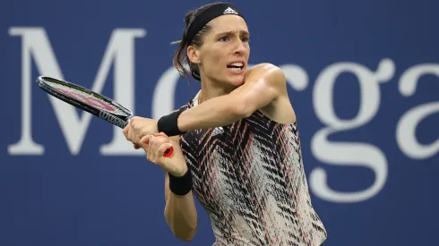 Andrea Petkovic of Germany returns the ball against Garbine Muguruza of Spain during her Women's Singles US Open game.
