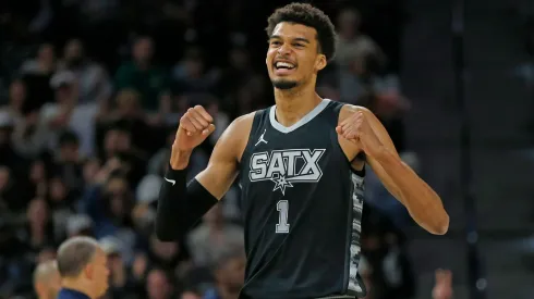 Victor Wembanyama #1 of the San Antonio Spurs reacts after a basket against the Los Angeles Clippers.