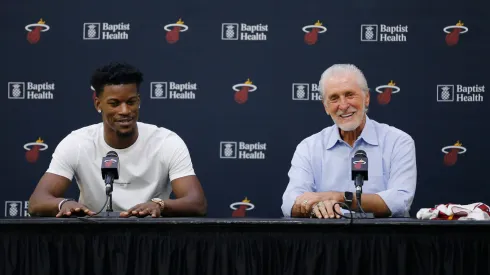 Jimmy Butler #22 of the Miami Heat and president Pat Riley speak to the media during his introductory press conference at American Airlines Arena.
