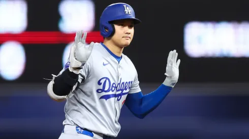 Shohei Ohtani #17 of the Los Angeles Dodgers reacts after hitting a double against the Miami Marlins during the first inning of the game at loanDepot park.
