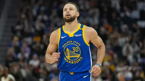 Stephen Curry #30 of the Golden State Warriors reacts after making a three-point shot against the Los Angeles Lakers.
