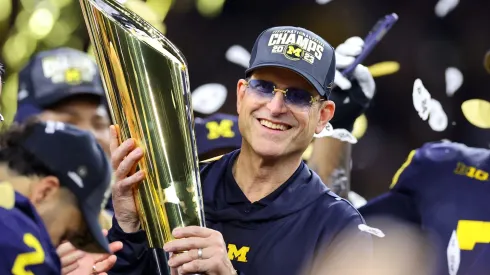 Head coach Jim Harbaugh of the Michigan Wolverines celebrates after defeating the Washington Huskies during the 2024 CFP National Championship game.
