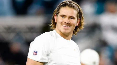 Justin Herbert #10 of the Los Angeles Chargers warms up prior to a game against the Jacksonville Jaguars in the AFC Wild Card playoff game.
