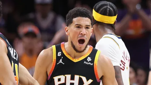 Devin Booker #1 of the Phoenix Suns reacts after scoring against the Denver Nuggets during the first half of Game Four of the NBA Western Conference Semifinals
