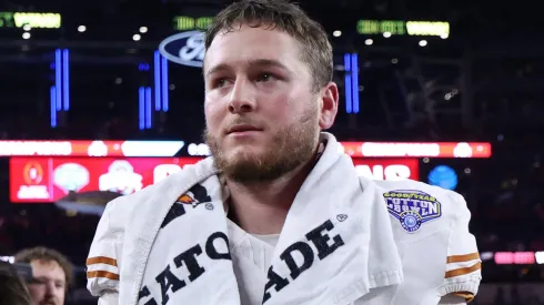 Quinn Ewers #3 of the Texas Longhorns walks off the field after losing to the Ohio State Buckeyes 28-14 in the Goodyear Cotton Bowl at AT&T Stadium on January 10, 2025 in Arlington, Texas.