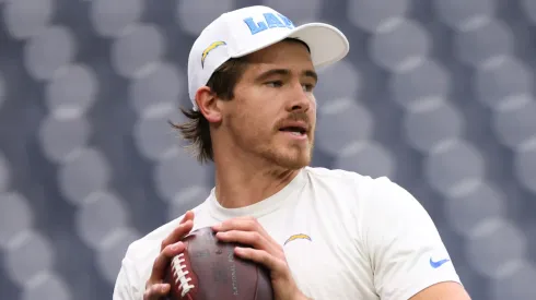 Justin Herbert of the Los Angeles Chargers warms up prior to a game against the Houston Texans during the AFC Wild Card Playoffs.