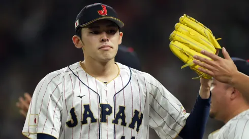 Roki Sasaki #14 of Team Japan reacts after an out in the third inning against Team Mexico during the World Baseball Classic Semifinals at loanDepot park on March 20, 2023 in Miami, Florida.