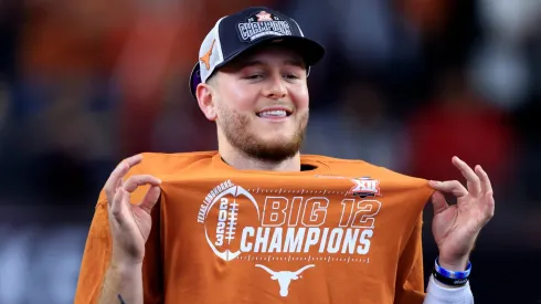 Quarterback Quinn Ewers #3 of the Texas Longhorns celebrates after Texas defeated the Oklahoma State Cowboys in the Big 12 Championship at AT&T Stadium on December 2, 2023 in Arlington, Texas.