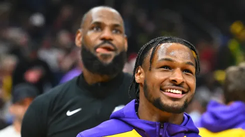 Bronny James #9 and LeBron James #23 of the Los Angeles Lakers warms up prior to the game against the Cleveland Cavaliers