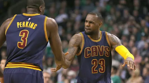 LeBron James #23 of the Cleveland Cavaliers reacts with Kendrick Perkins #3 against Boston Celtics after the second quarter in Game Four during the first round of the 2015 NBA Playoffs on April 26, 2015 at TD Garden in Boston, Massachusetts.