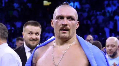 Oleksandr Usyk celebrates with their belts after their victory over Anthony Joshua in their World Heavyweight Championship fight during the Rage on the Red Sea Heavyweight Title Fight at King Abdullah Sports City Arena on August 20, 2022 in Jeddah, Saudi Arabia.