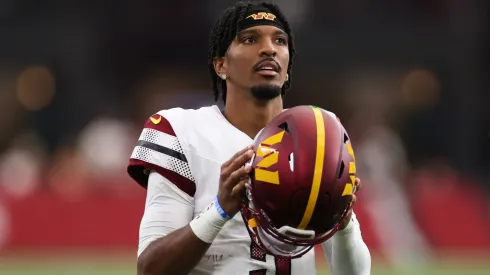 Jayden Daniels #5 of the Washington Commanders looks on during the second half against the Arizona Cardinals at State Farm Stadium on September 29, 2024.