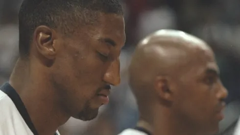 Forward Scottie Pippen, left, of Dream Team III during the singing of the national anthems as teammates Charles Barkley