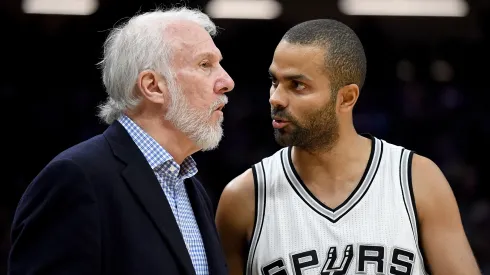 Gregg Popovich of the San Antonio Spurs talks with Tony Parker during an NBA game against the Sacramento Kings on October 27, 2016.