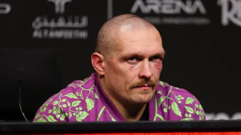 Oleksandr Usyk speaks to the media while sitting in front of a 'Ukraine Wow: Mazepa's Saber' in a post fight after the IBF, IBO, WBA, WBC and WBO Undisputed World Heavyweight titles' fight between Oleksandr Usyk and Tyson Fury.