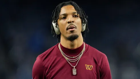 Jayden Daniels #5 of the Washington Commanders looks on during warmups prior to playing the Detroit Lions in the NFC Divisional Playoff at Ford Field on January 18, 2025 in Detroit, Michigan.