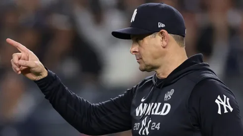Manager Aaron Boone #17 of the New York Yankees motions to the bullpen during the eighth inning of Game Five of the 2024 World Series against the Los Angeles Dodgers at Yankee Stadium on October 30, 2024 in the Bronx borough of New York City.