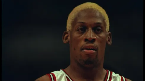 Dennis Rodman #91 of the Chicago Bulls stands on the court at the United Center in Chicago.