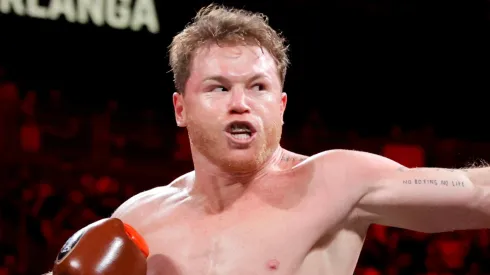 WBC/WBA/WBO super middleweight champion Canelo Alvarez punches Edgar Berlanga during the first round of a title fight at T-Mobile Arena on September 14, 2024 in Las Vegas, Nevada.