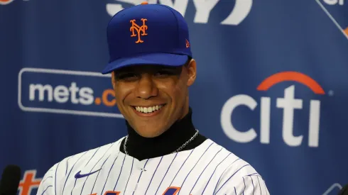 Juan Soto of the New York Mets sits at the das with his agent Scott Boras during his introductory press conference at Citi Field on December 12, 2024 in New York City.