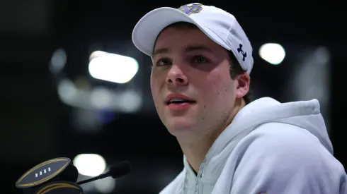 Riley Leonard #13 of the Notre Dame Fighting Irish speaks to the media during the Notre Dame Fighting Irish media day at the Georgia World Congress Center prior to the 2025 CFP National Championship between the Ohio State Buckeyes and Notre Dame Fighting Irish on January 18, 2025 in Atlanta, Georgia.