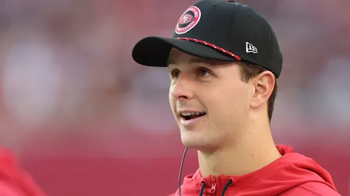 Brock Purdy #13 of the San Francisco 49ers looks on from the sidelines during the second quarter against the Arizona Cardinals at State Farm Stadium on January 05, 2025 in Glendale, Arizona.