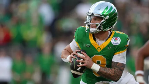 Dillon Gabriel #8 of the Oregon Ducks scrambles with the ball during the Rose Bowl game against the Ohio State Buckeyes at Rose Bowl Stadium on January 01, 2025 in Pasadena, California.