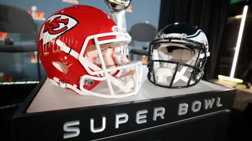 A Kansas City Chiefs helmet, the Vince Lombardi Trophy and a Philadelphia Eagles helmet are seen before NFL Commissioner Roger Goodell's Super Bowl Press Conference ahead of Super Bowl LIX.