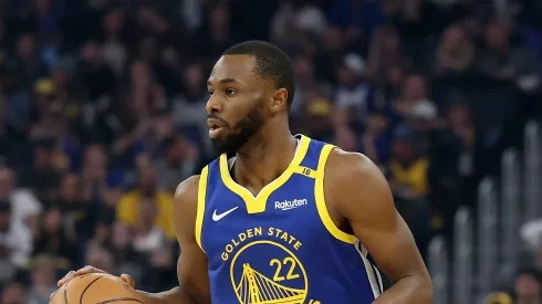 Andrew Wiggins #22 of the Golden State Warriors dribbles the ball against the Phoenix Suns