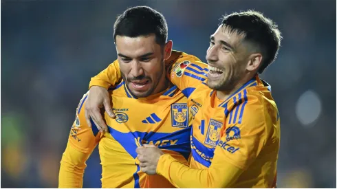 Juan Vigon of Tigres celebrates with teammate