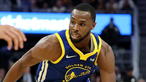 Andrew Wiggins #22 of the Golden State Warriors dribbles the ball against the Dallas Mavericks
