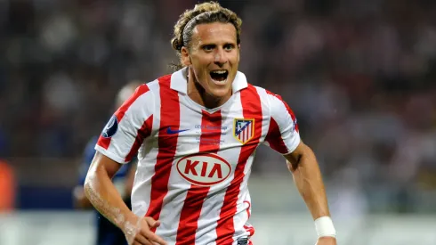Diego Forlan of Atletico Madrid competes for the ball during the UEFA Super Cup between Inter and Atletico Madrid.