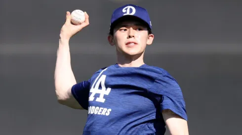 Roki Sasaki #11 of the Los Angeles Dodgers throws during workouts at Camelback Ranch on February 11, 2025 in Glendale, Arizona.